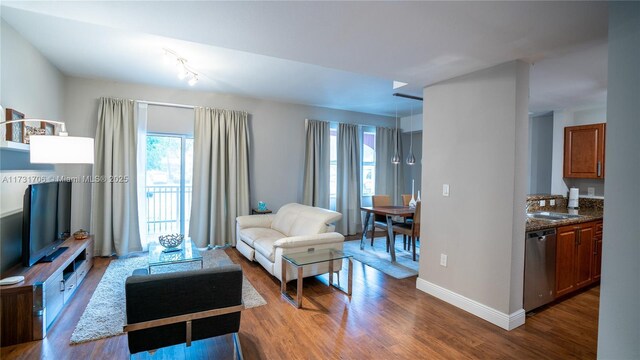 living room with wood finished floors and baseboards