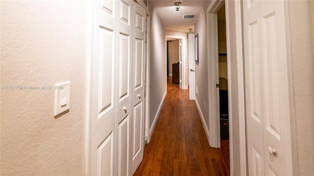 hall with dark hardwood / wood-style floors