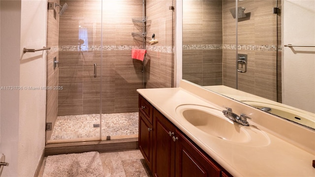 full bathroom featuring vanity and a stall shower