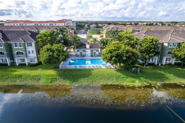 birds eye view of property with a residential view and a water view