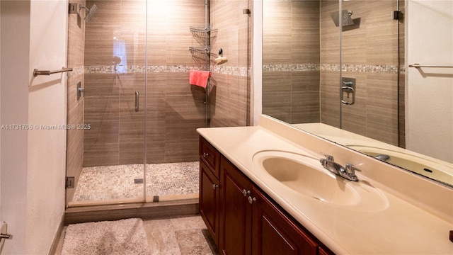 bathroom with vanity and an enclosed shower