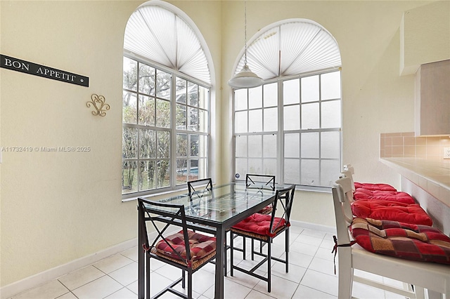 dining space with light tile patterned floors