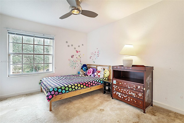 bedroom with ceiling fan and light colored carpet