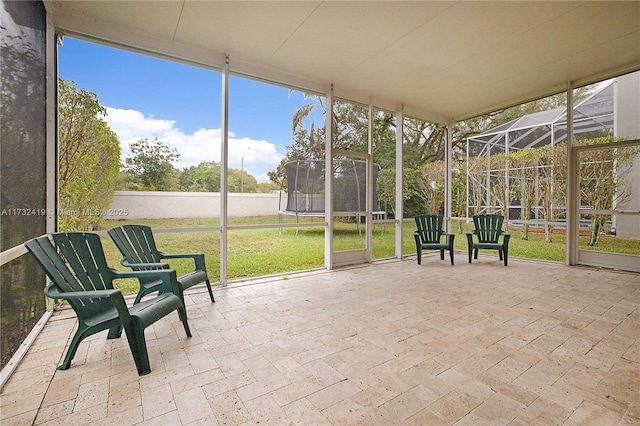 unfurnished sunroom with a wealth of natural light