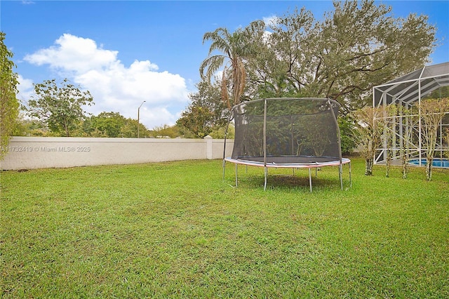 view of yard with a trampoline