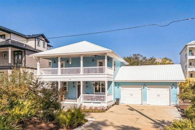 view of front facade with a garage, a balcony, and covered porch