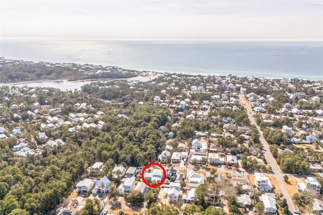 drone / aerial view featuring a residential view and a water view