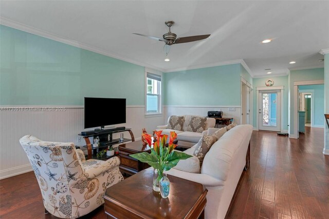 bedroom featuring a raised ceiling, ornamental molding, dark hardwood / wood-style floors, and connected bathroom