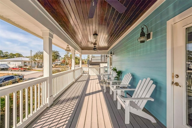 deck with a porch and a ceiling fan