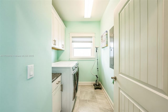 laundry room featuring cabinet space, baseboards, and independent washer and dryer