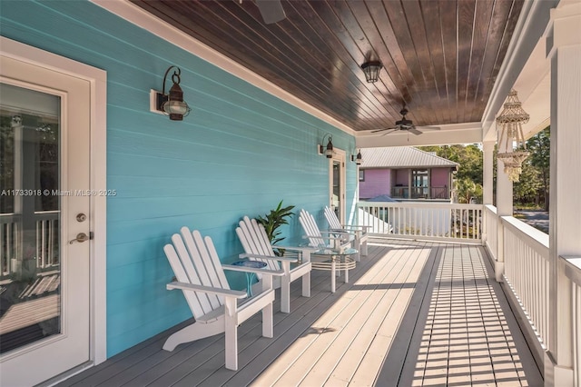 wooden deck featuring ceiling fan and a porch