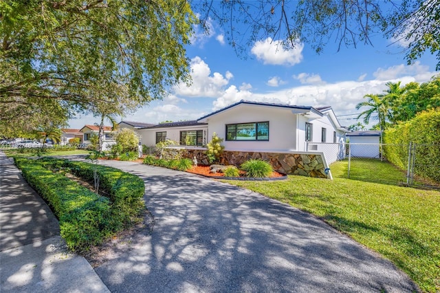 single story home with a front yard