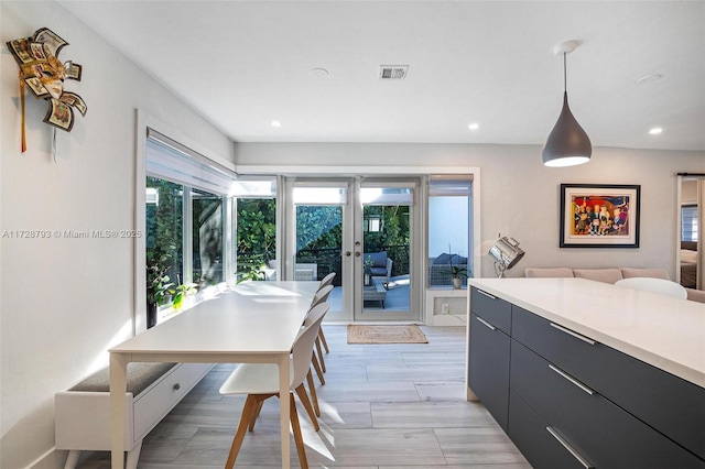 kitchen featuring decorative light fixtures and light wood-type flooring