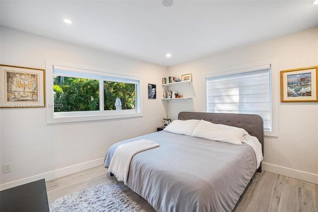 bedroom with light hardwood / wood-style floors