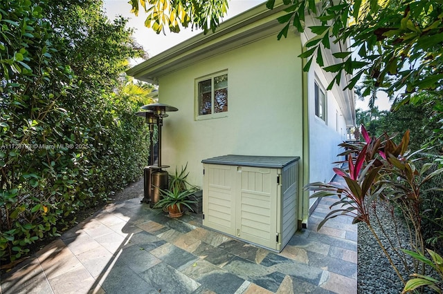 view of side of home with a patio