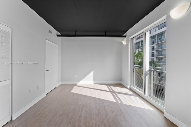 empty room with light wood-type flooring