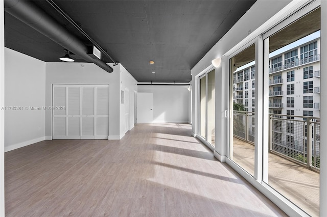 corridor featuring hardwood / wood-style flooring