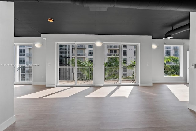 spare room with hardwood / wood-style flooring