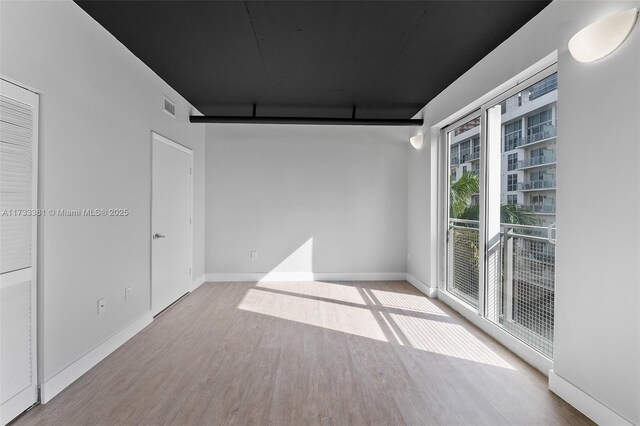 455 NE 25th St Unit 509, Miami, FL 33137 - corridor with wood finished floors and baseboards