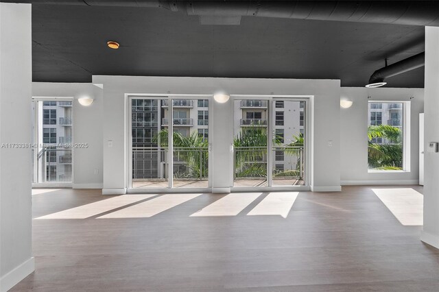455 NE 25th St Unit 509, Miami, FL 33137 - unfurnished room featuring wood finished floors and baseboards