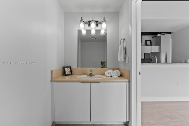 bathroom with vanity and ceiling fan