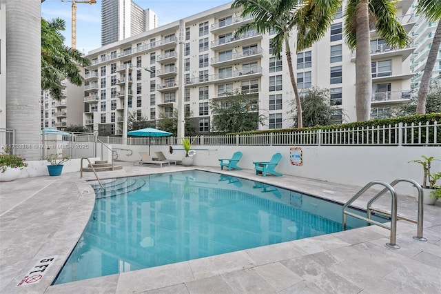 view of swimming pool with a patio area