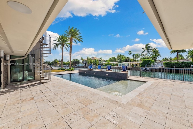 view of pool with a fenced in pool, a patio area, and fence