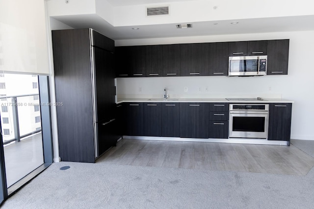 kitchen featuring appliances with stainless steel finishes and sink