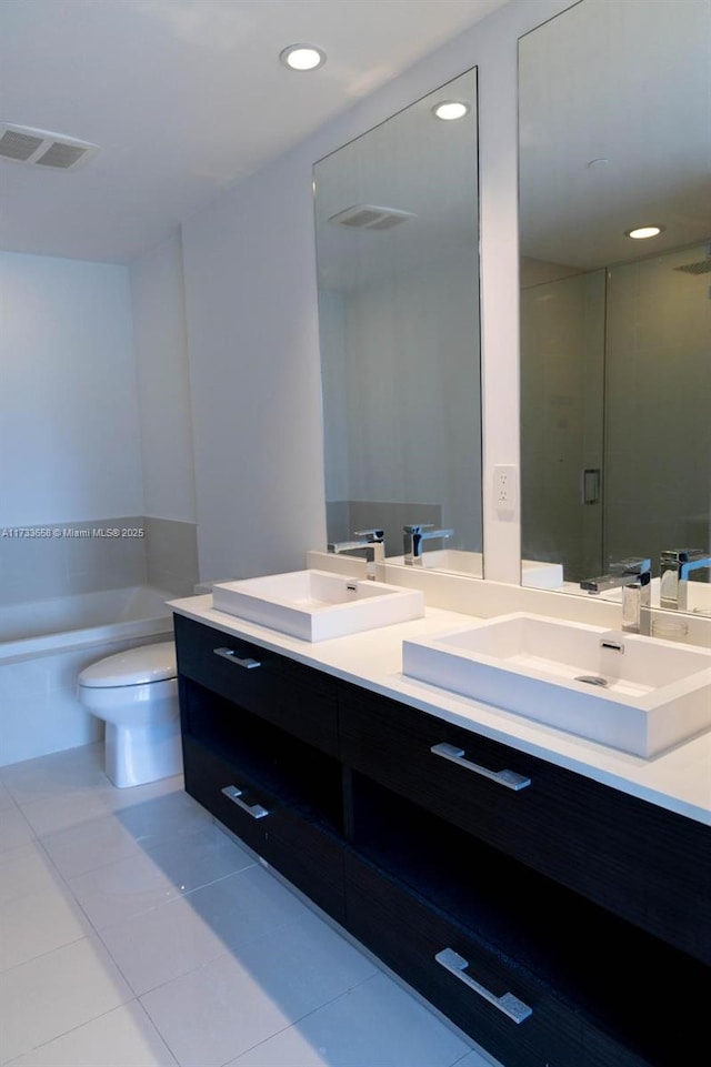 full bathroom with vanity, toilet, separate shower and tub, and tile patterned flooring