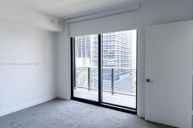 carpeted empty room featuring a healthy amount of sunlight