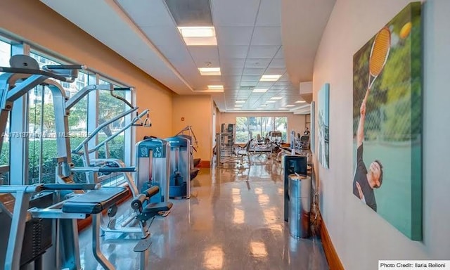 interior space with concrete floors and baseboards