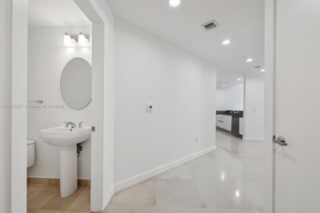 bathroom featuring tile patterned floors and toilet