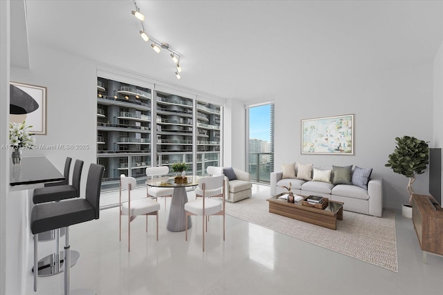 interior space featuring track lighting and expansive windows