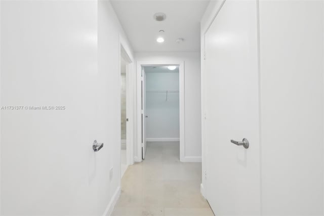 corridor featuring baseboards
