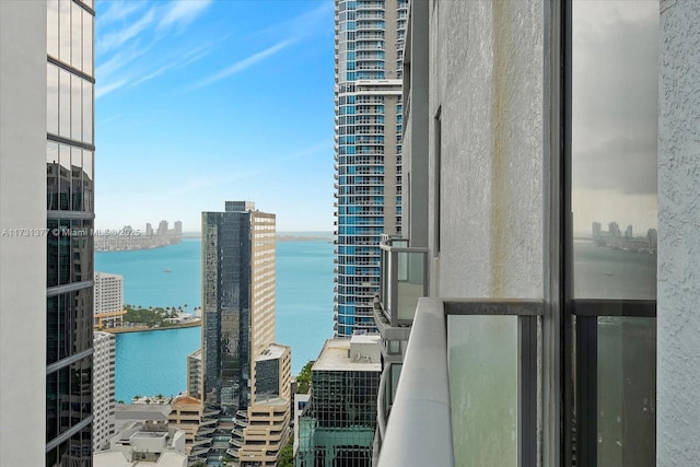 exterior space featuring a water view and a city view