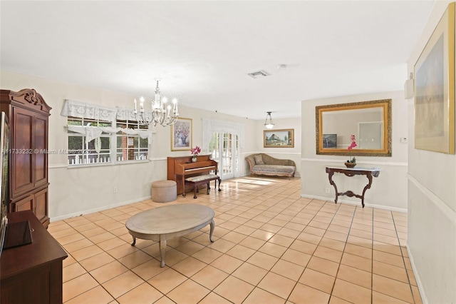 tiled living room featuring a chandelier