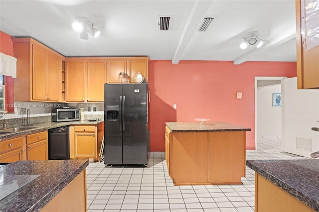 kitchen featuring sink, stainless steel appliances, a center island, light tile patterned flooring, and beamed ceiling