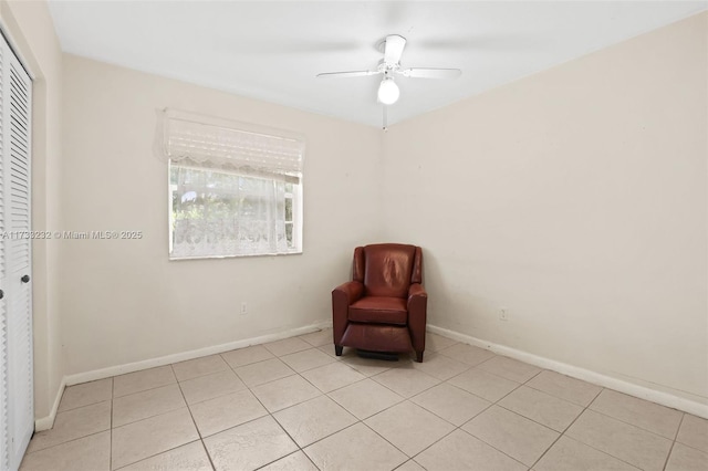 unfurnished room with light tile patterned floors and ceiling fan