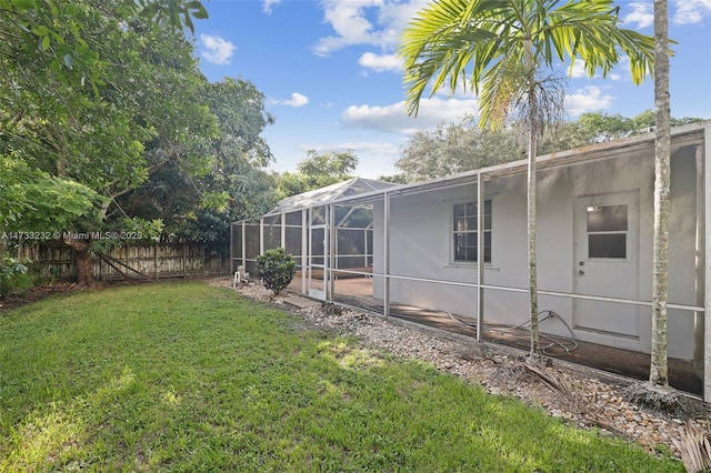 view of yard with glass enclosure