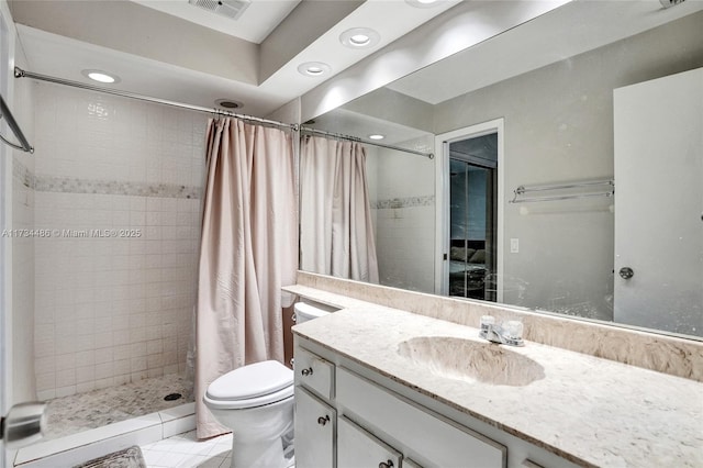 bathroom featuring vanity, toilet, and a shower with shower curtain