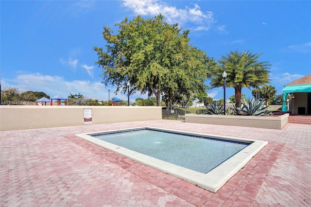 view of pool featuring a patio area