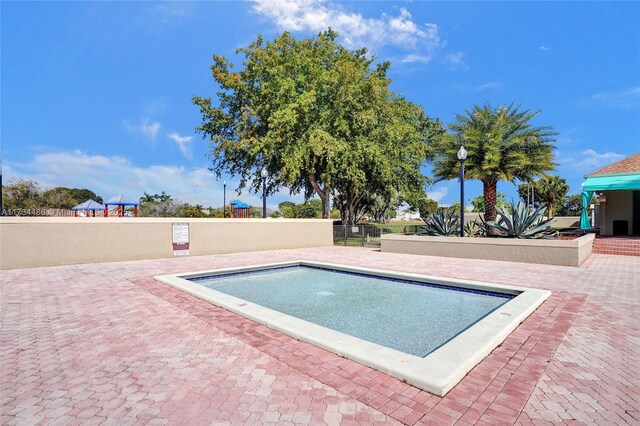 view of pool featuring a patio area