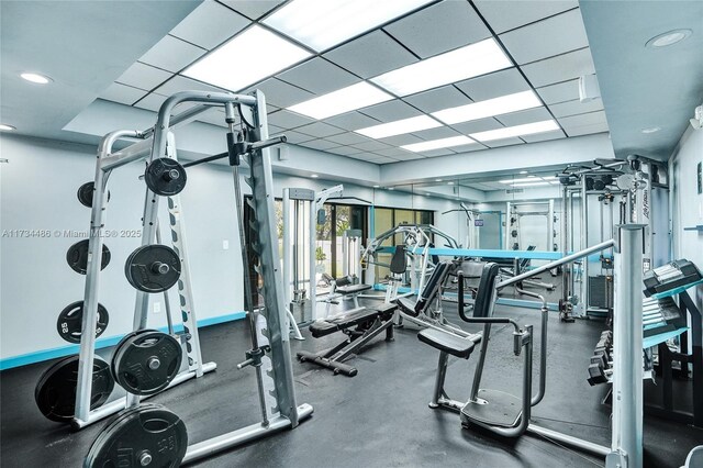 exercise room featuring a drop ceiling