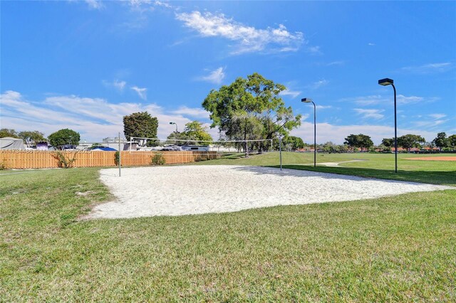 view of community featuring a yard and volleyball court