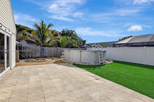 view of patio with a fenced in pool