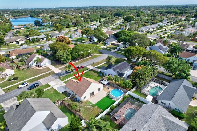 birds eye view of property with a water view