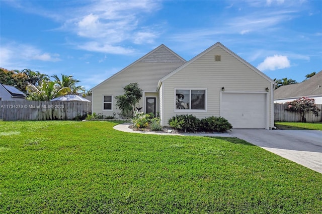 view of front of house featuring a garage and a front lawn