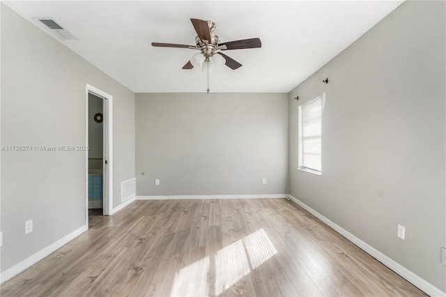 unfurnished room with a ceiling fan, baseboards, visible vents, and light wood finished floors