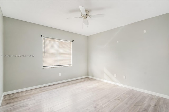 unfurnished room with light wood-type flooring, ceiling fan, and baseboards