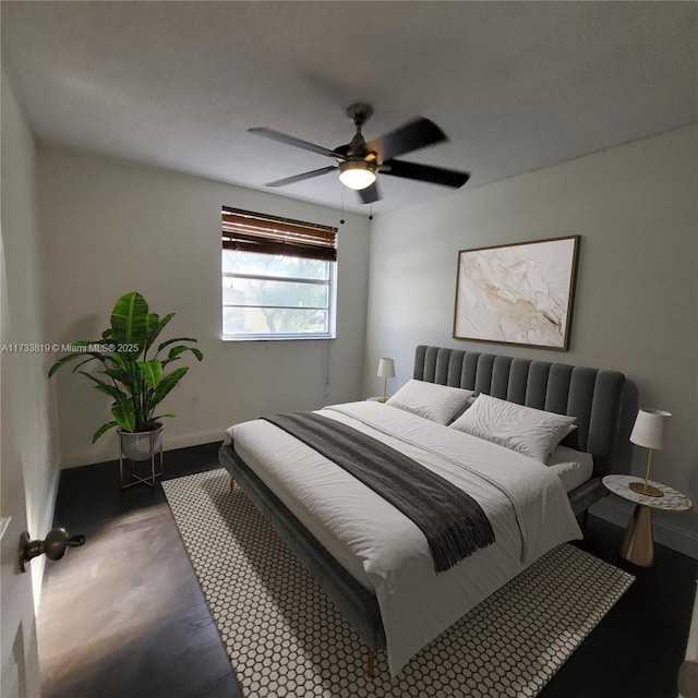 bedroom featuring dark wood-type flooring and ceiling fan